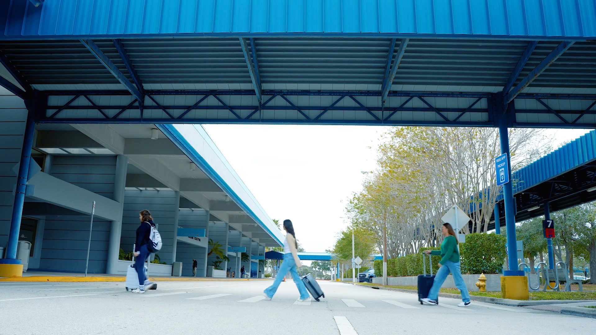 Passengers walking into airport